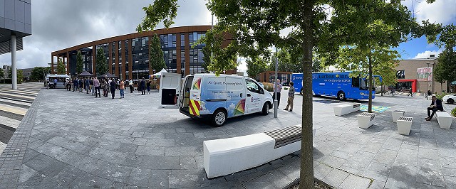 Wide angle view at UWE of tour bus and Smogmobile copy2
